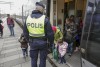 Người tỵ nạn xuống tàu tại Đan Mạch - Ảnh: Stig-Ake Jonsson (AFP)