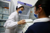 Vaccine Trung Quốc sẽ góp phần khiến dân Hung “được tự do” sớm? - Ảnh: Stringer (Reuters)