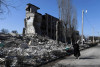 Một trường học bị pháo binh Nga phá hủy hoàn toàn trong khuôn khổ “Chiến dịch quân sự đặc biệt” ở TP. Kharkiv, ngày 23/3/2022 - Ảnh: Andrzej Lange (EPA)